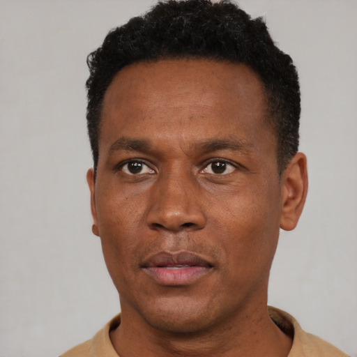 Neutral black adult male with short  black hair and brown eyes