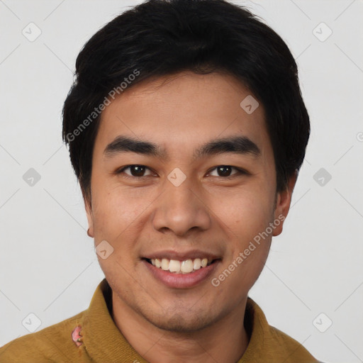 Joyful asian young-adult male with short  black hair and brown eyes