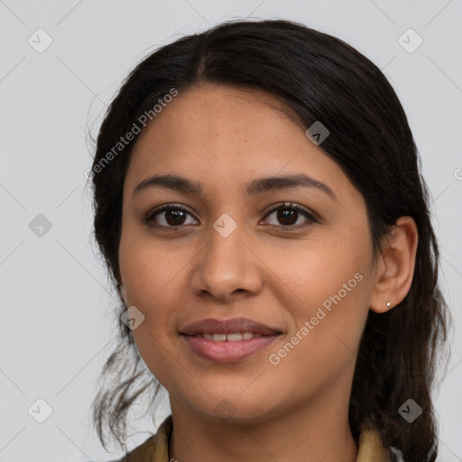 Joyful latino young-adult female with medium  brown hair and brown eyes