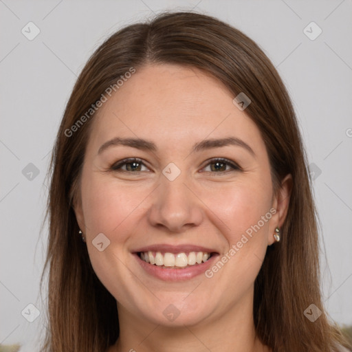 Joyful white young-adult female with long  brown hair and brown eyes