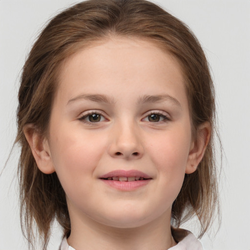 Joyful white child female with medium  brown hair and brown eyes