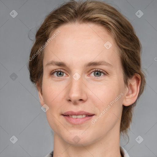 Joyful white adult female with medium  brown hair and grey eyes