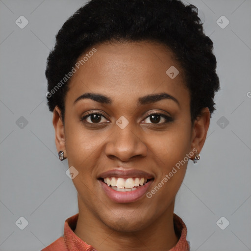 Joyful black young-adult female with short  black hair and brown eyes