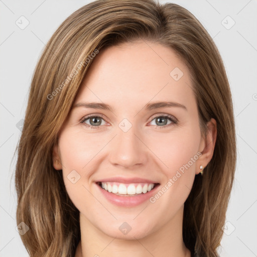 Joyful white young-adult female with long  brown hair and green eyes