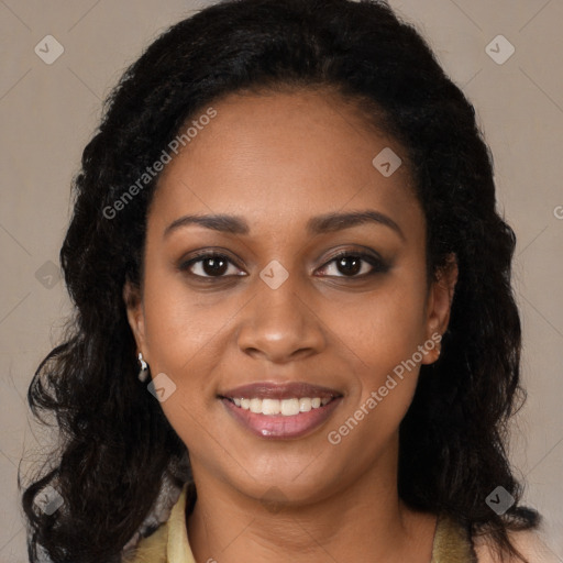 Joyful black young-adult female with long  brown hair and brown eyes