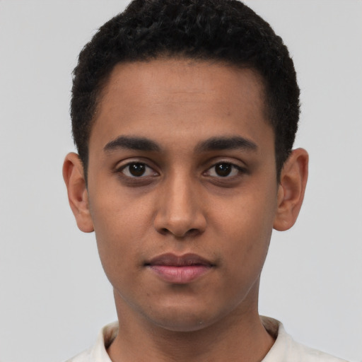 Neutral latino young-adult male with short  black hair and brown eyes
