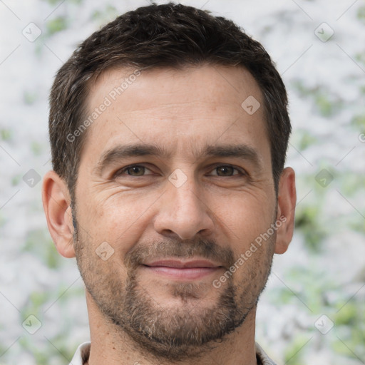 Joyful white adult male with short  brown hair and brown eyes