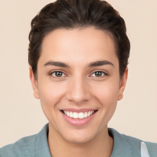 Joyful white young-adult female with short  brown hair and brown eyes