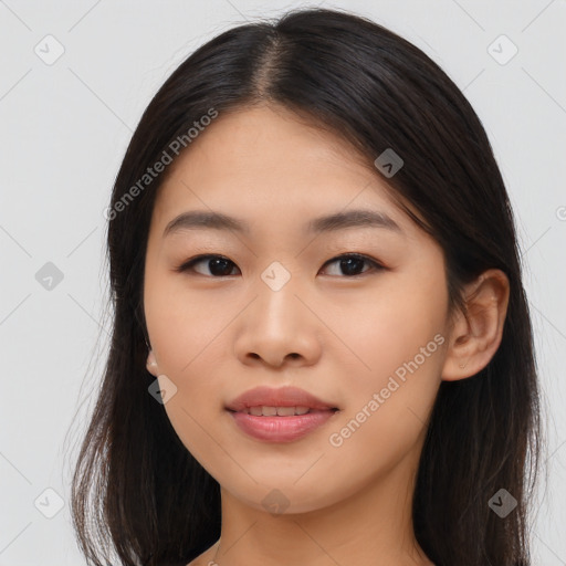 Joyful asian young-adult female with long  brown hair and brown eyes