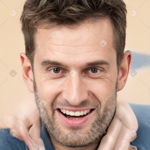 Joyful white adult male with short  brown hair and brown eyes