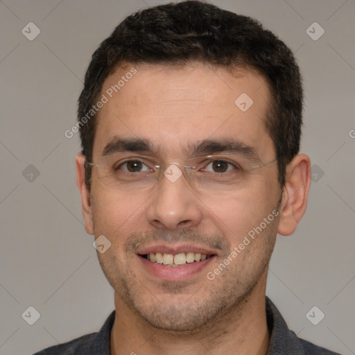 Joyful white adult male with short  brown hair and brown eyes