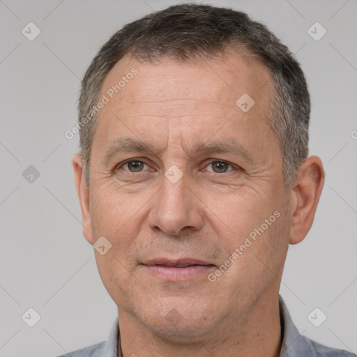 Joyful white middle-aged male with short  brown hair and brown eyes