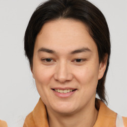 Joyful white adult female with medium  brown hair and brown eyes