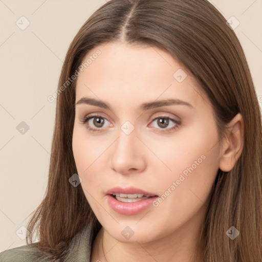 Neutral white young-adult female with long  brown hair and brown eyes