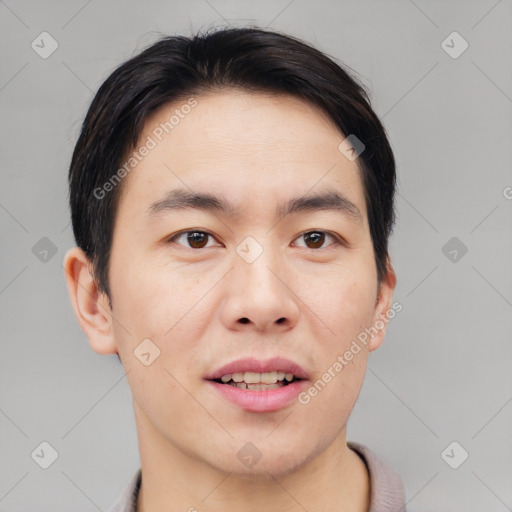 Joyful asian young-adult male with short  brown hair and brown eyes