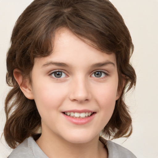 Joyful white child female with medium  brown hair and brown eyes