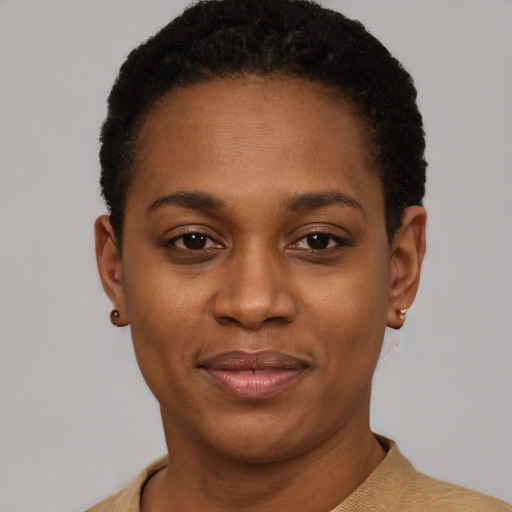 Joyful latino young-adult female with short  black hair and brown eyes