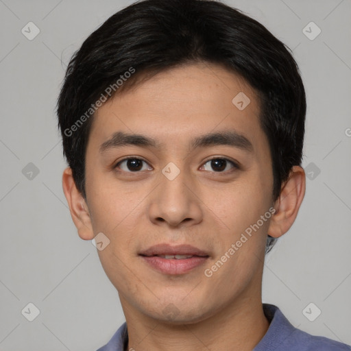 Joyful asian young-adult male with short  black hair and brown eyes
