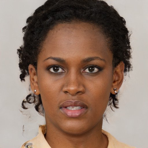 Neutral black young-adult female with medium  brown hair and brown eyes