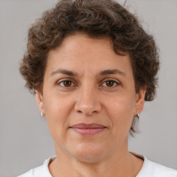 Joyful white adult female with short  brown hair and brown eyes