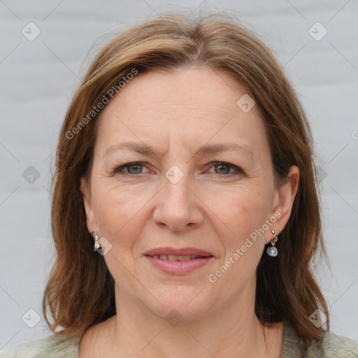 Joyful white adult female with medium  brown hair and grey eyes