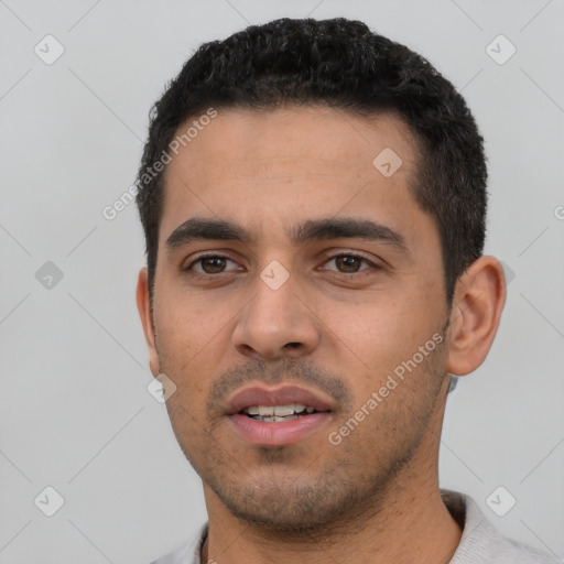 Neutral latino young-adult male with short  black hair and brown eyes