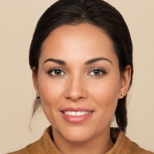 Joyful white young-adult female with long  brown hair and brown eyes