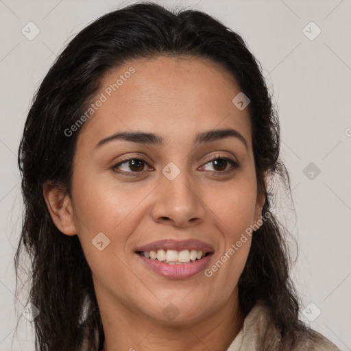 Joyful latino young-adult female with long  brown hair and brown eyes