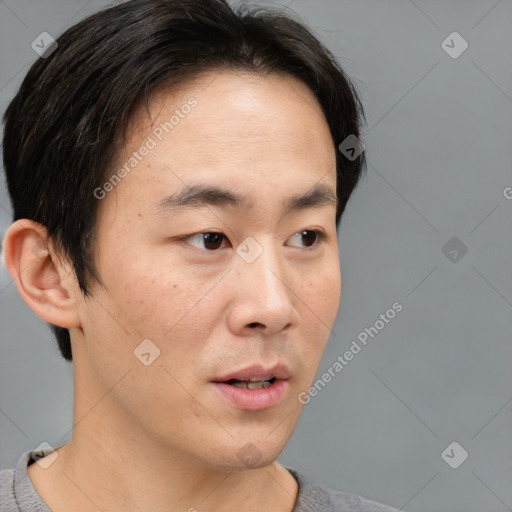 Neutral asian adult male with short  brown hair and brown eyes