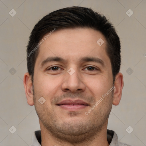 Joyful white adult male with short  brown hair and brown eyes