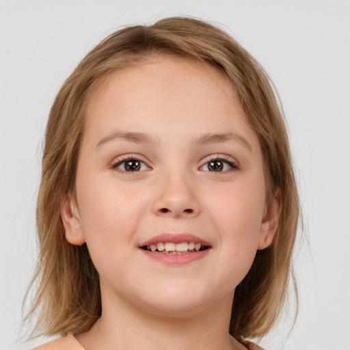 Joyful white child female with medium  brown hair and brown eyes