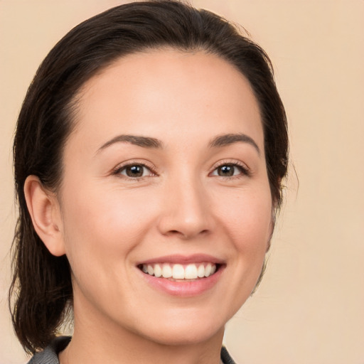 Joyful white young-adult female with medium  brown hair and brown eyes