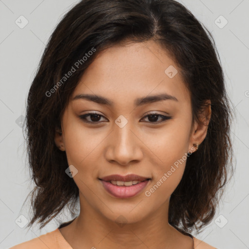 Joyful latino young-adult female with medium  brown hair and brown eyes