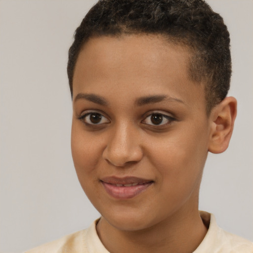 Joyful black young-adult female with short  brown hair and brown eyes