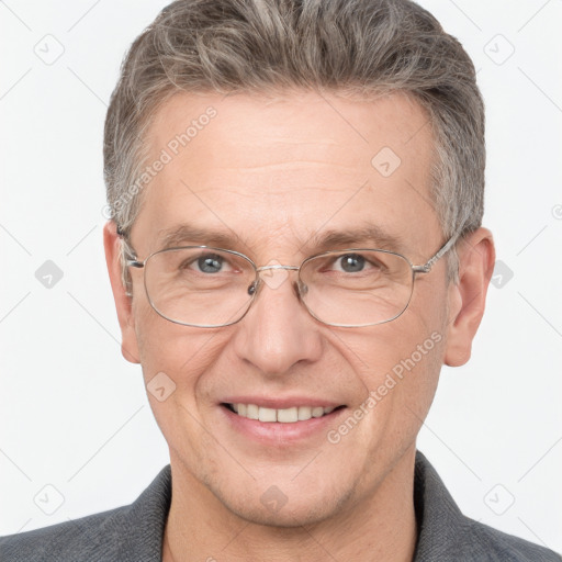 Joyful white adult male with short  brown hair and grey eyes