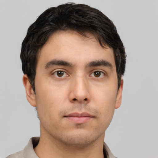 Neutral white young-adult male with short  brown hair and brown eyes