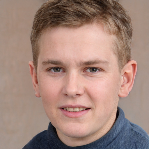 Joyful white young-adult male with short  brown hair and blue eyes