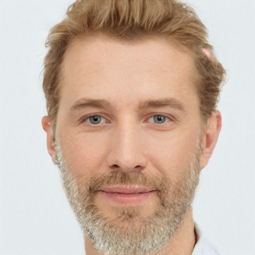 Joyful white adult male with short  brown hair and grey eyes