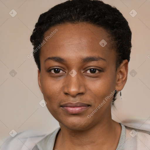 Joyful black young-adult female with short  black hair and brown eyes