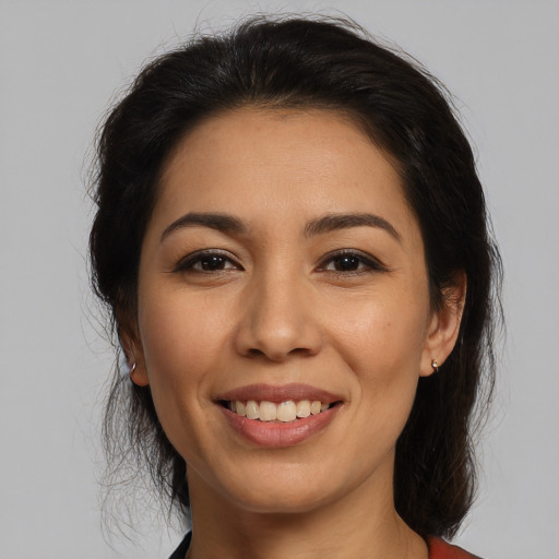 Joyful white young-adult female with long  brown hair and brown eyes