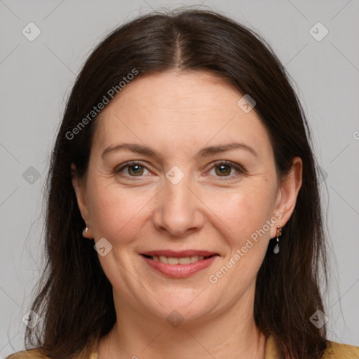 Joyful white adult female with medium  brown hair and brown eyes