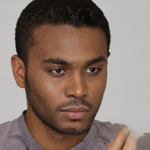 Neutral latino young-adult male with short  brown hair and brown eyes