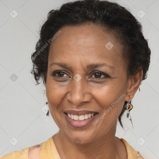 Joyful black adult female with short  brown hair and brown eyes