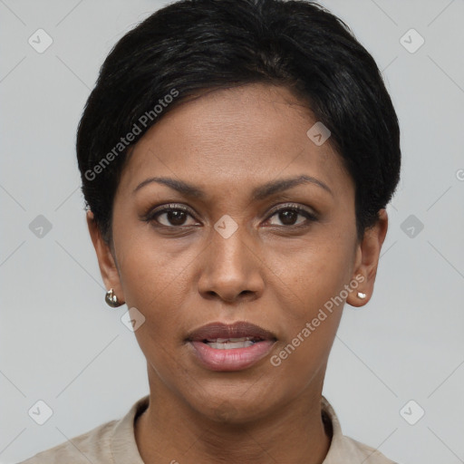 Joyful black young-adult female with short  black hair and brown eyes