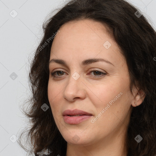 Joyful white adult female with long  brown hair and brown eyes