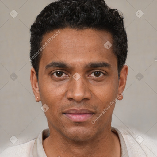 Joyful black young-adult male with short  black hair and brown eyes