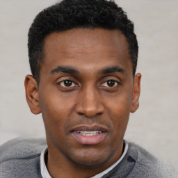 Neutral black young-adult male with short  black hair and brown eyes