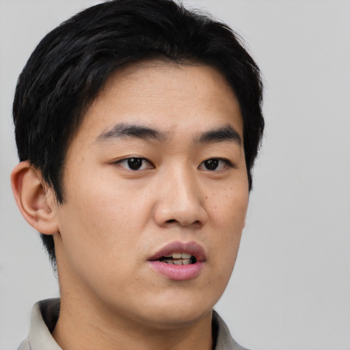 Neutral asian young-adult male with short  black hair and brown eyes
