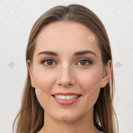 Joyful white young-adult female with long  brown hair and grey eyes