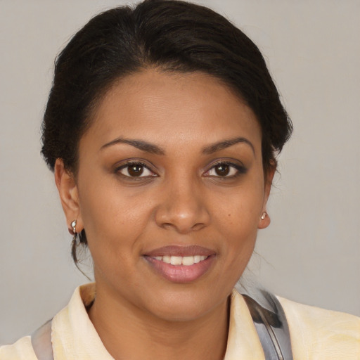 Joyful latino young-adult female with medium  brown hair and brown eyes